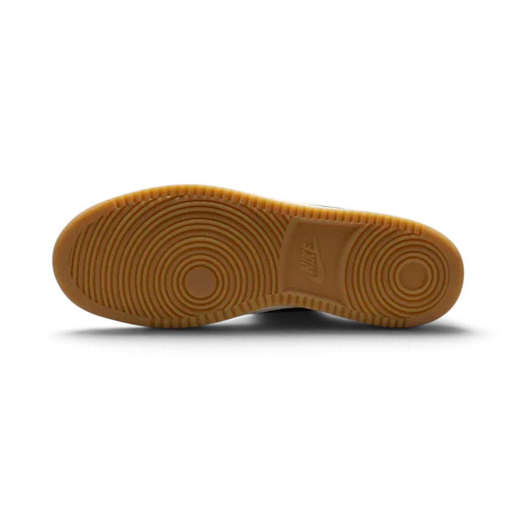 View of the rubber outsole, showcasing the classic pivot-circle traction pattern in a durable navy finish.