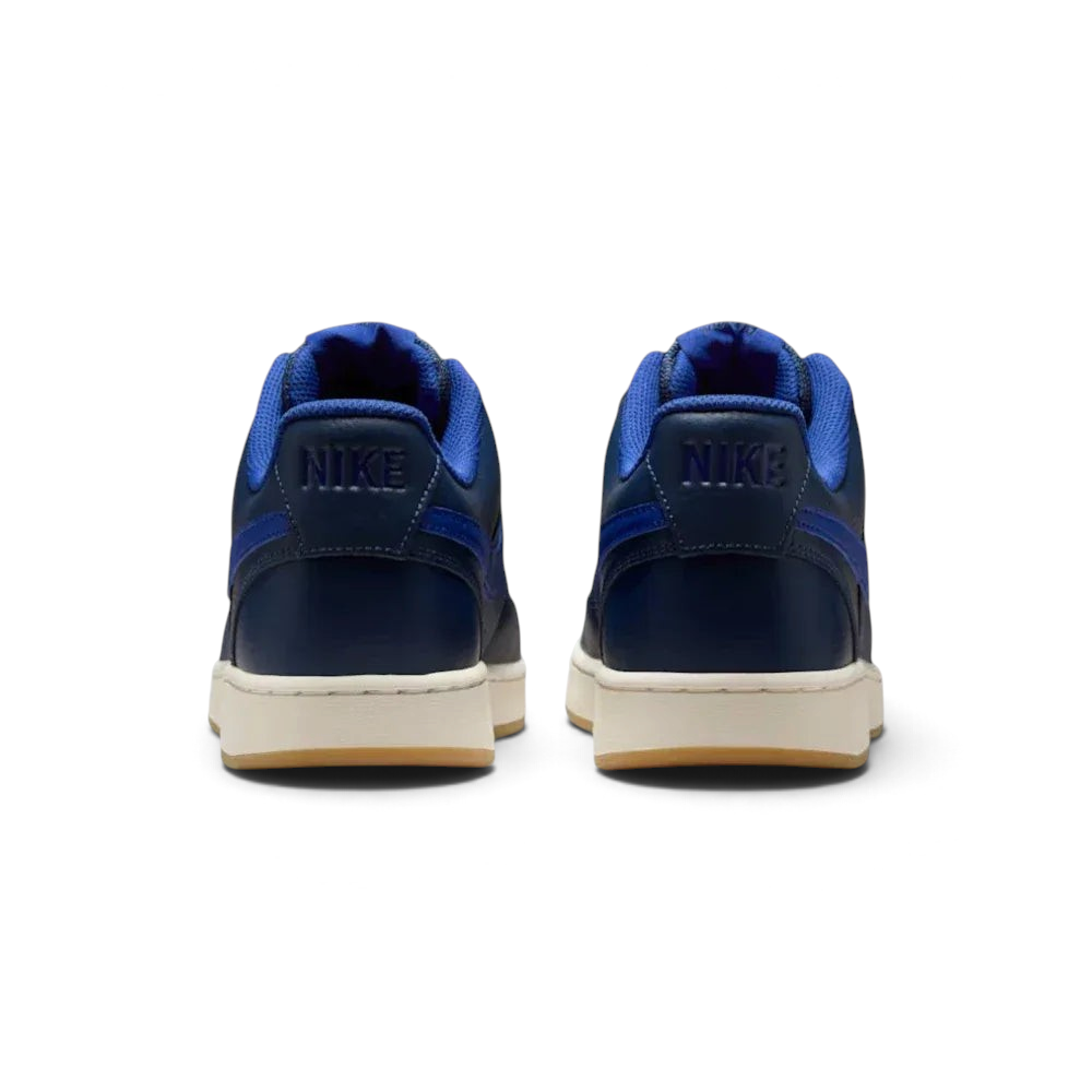 Rear view focusing on the embossed Nike branding on the heel tab and the clean stitching of the leather overlays.