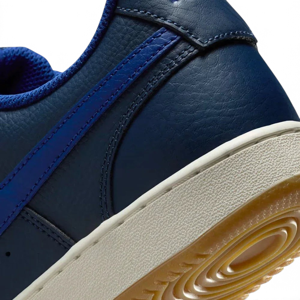 Detailed zoom on the midsole area, highlighting the classic cupsole construction and the textured rubber edge.