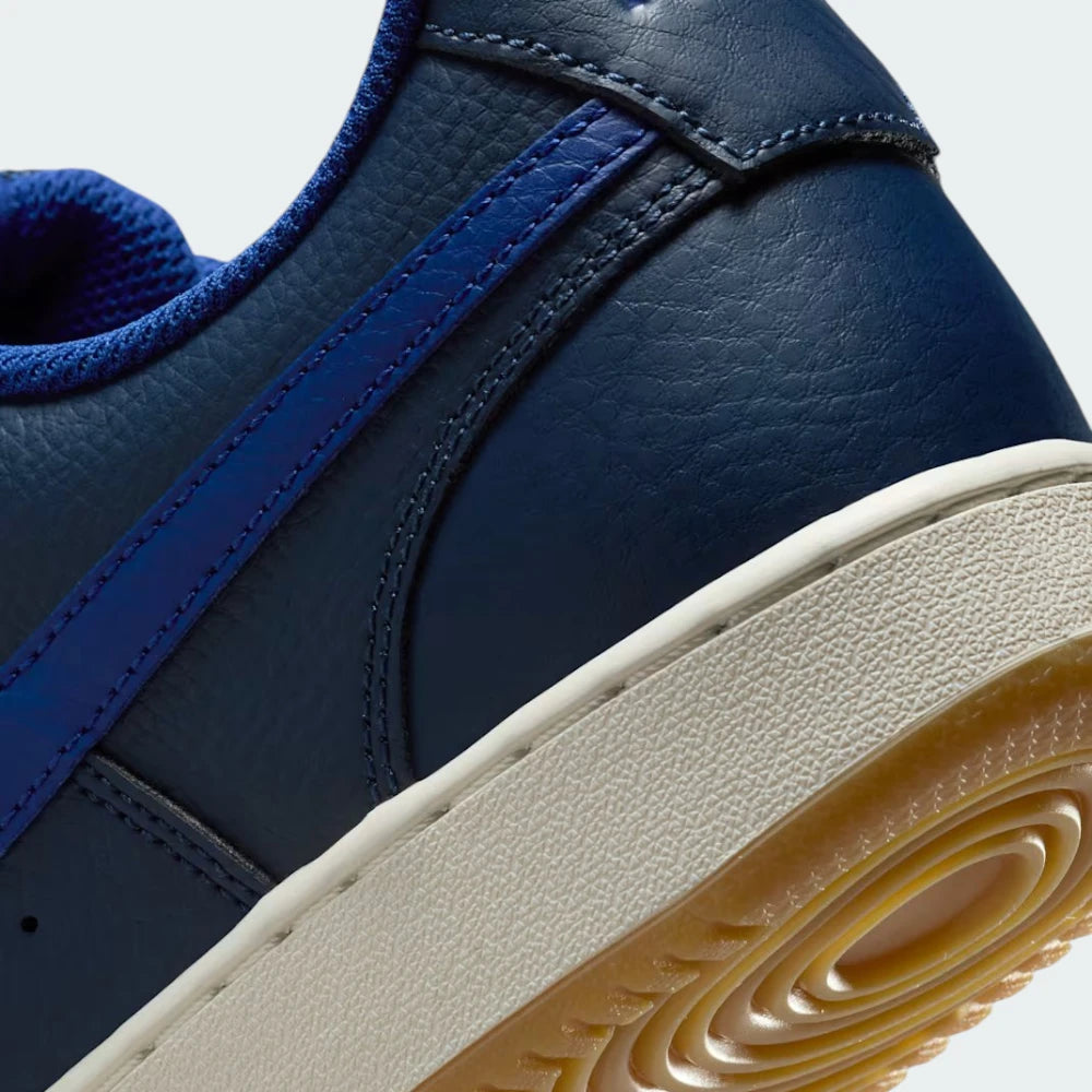 Detailed zoom on the midsole area, highlighting the classic cupsole construction and the textured rubber edge.