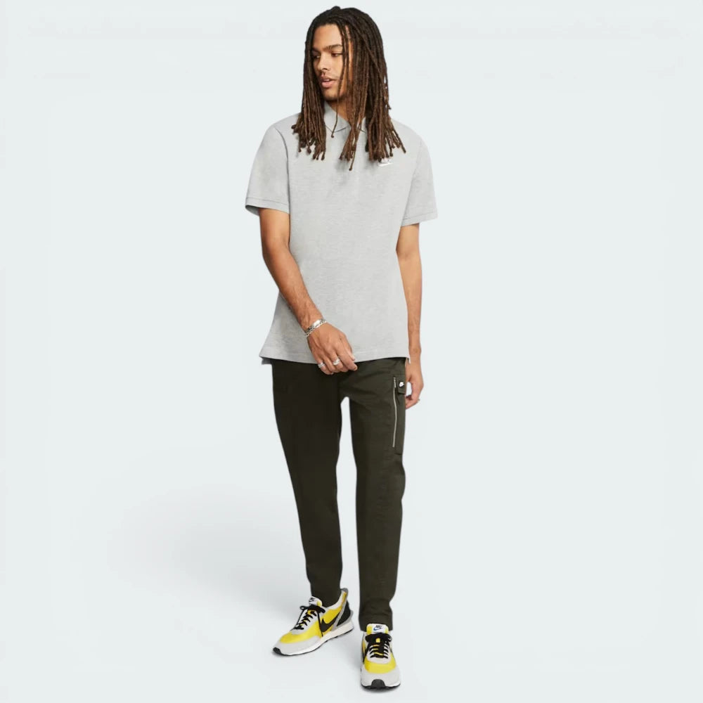 Full view of the garment, emphasizing the heathered grey fabric texture and the ribbed arm cuffs.