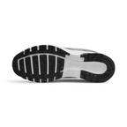 Displays the full-length black and white rubber sole, showcasing the classic waffle tread pods interlocked with a central white stability groove stamped with "NIKE" branding.