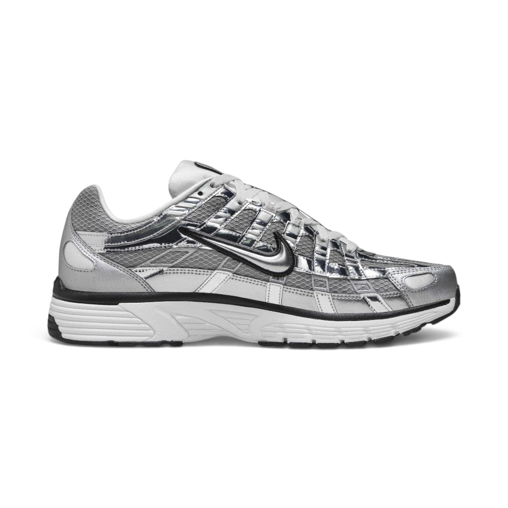 Highlights the inner profile showing the matching chrome overlay cage pattern, black Swoosh, white foam midsole wall, and structured grey mesh heel collar.