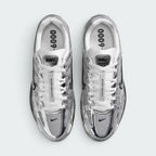 Focuses on the locked-in central lacing layout, displaying the white laces tracking through silver eyestays, central tongue ribbon printed with "BOWERMAN SERIES", metallic tongue tab badge, and insoles printed with bold "P-6000" graphics.