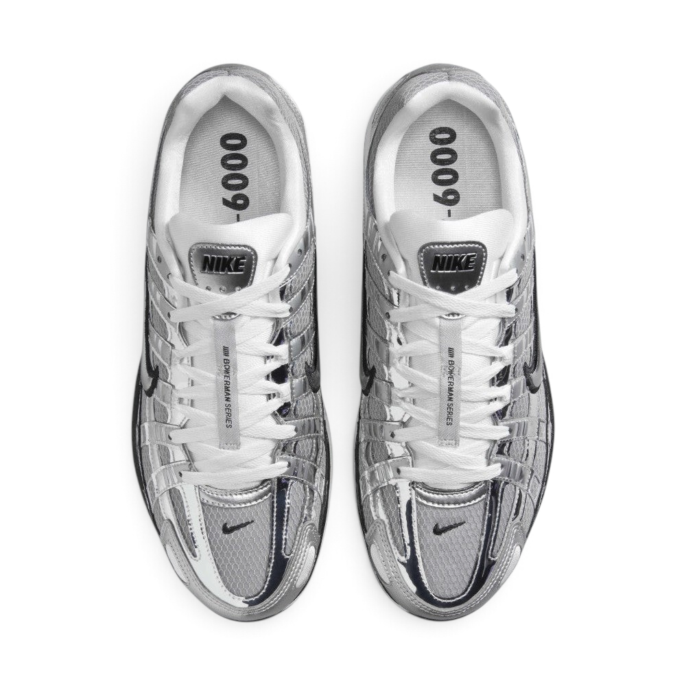 Focuses on the locked-in central lacing layout, displaying the white laces tracking through silver eyestays, central tongue ribbon printed with "BOWERMAN SERIES", metallic tongue tab badge, and insoles printed with bold "P-6000" graphics.