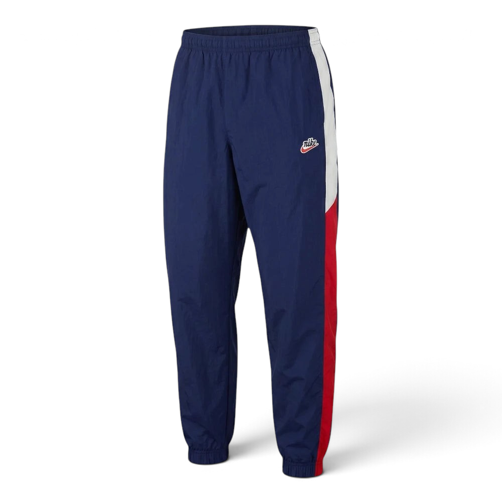 Focuses on the flat-laid waist configuration, displaying the perfect symmetry of the elasticated waistband, the tonal drawcords, and the crisp definition of the embroidered Nike logo stamped cleanly onto the upper thigh.