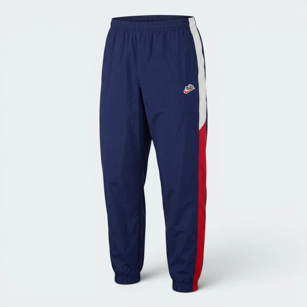 Focuses on the flat-laid waist configuration, displaying the perfect symmetry of the elasticated waistband, the tonal drawcords, and the crisp definition of the embroidered Nike logo stamped cleanly onto the upper thigh.