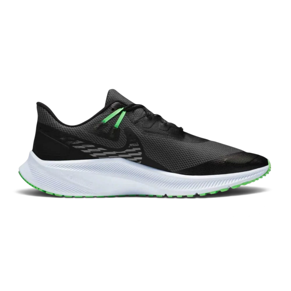 Highlights the high-velocity sweep of the Obsidian Mist Nike Swoosh, showing the professional, technical texture of the water-repellent black Shield upper resting above the textured grey midsole wall. Main image