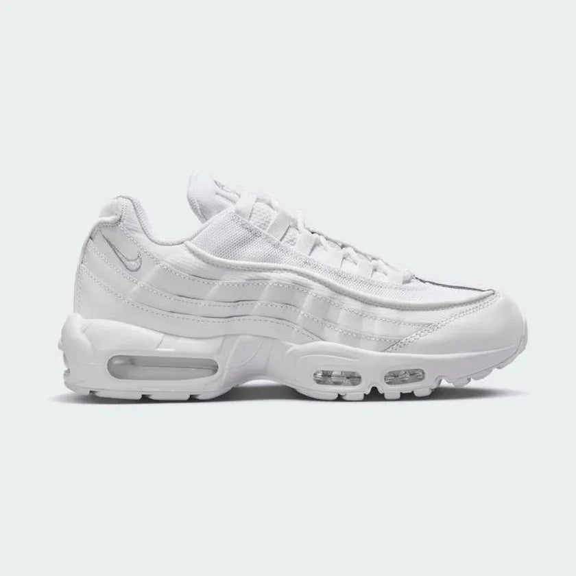 Nike Air Max 95 Essential Men's White Trainers CT1268-100 side view showing layered white upper and visible Air units in heel and forefoot Main image
