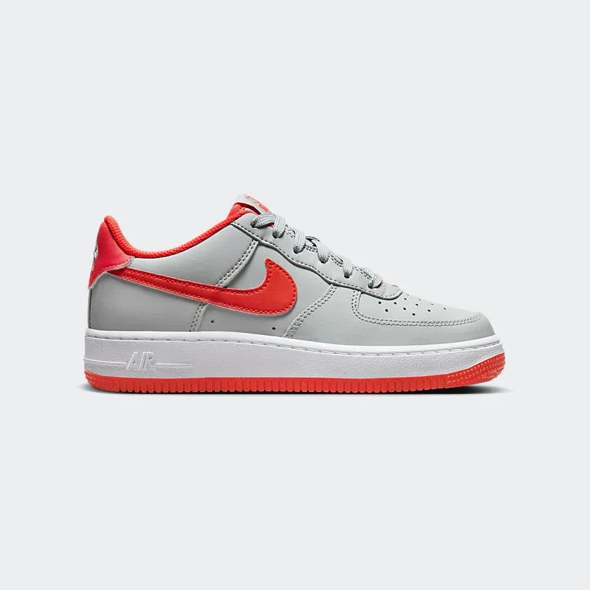 Highlights the high-velocity Bright Crimson Swoosh against the professional Light Smoke Grey leather. Main image