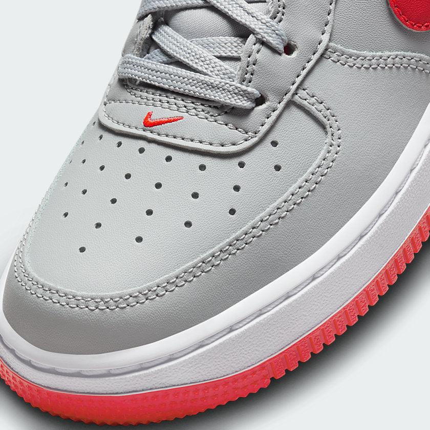 Details the high-definition leather grain and the precision of the crimson accents.