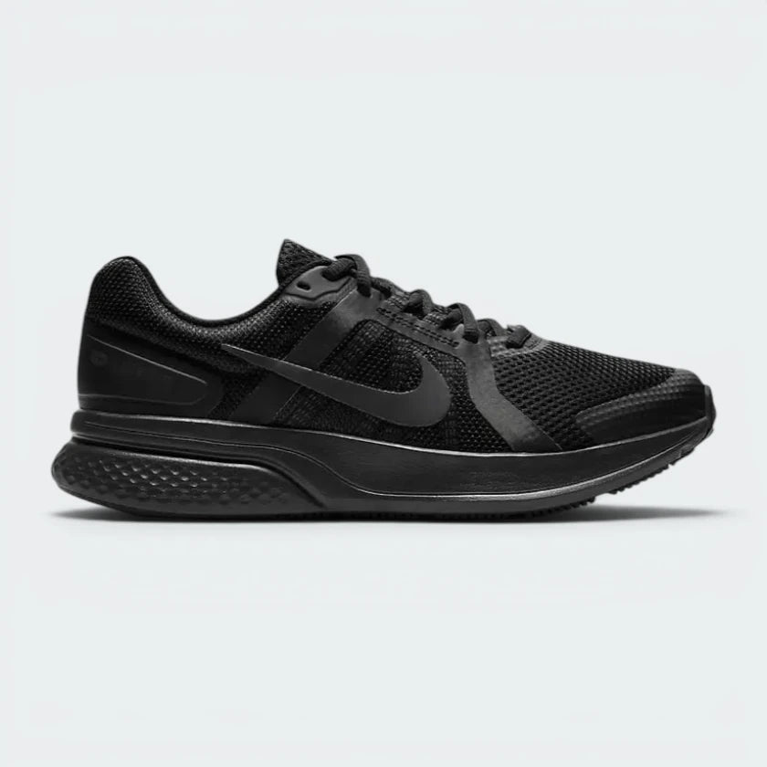 Highlights the high-velocity sweep of the Dark Smoke Grey Nike Swoosh, showing the professional, clean texture of the black mesh upper resting above the sleek, lightweight foam midsole wall. Main image