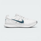 Highlights the lateral profile of the shoe, featuring a dark teal Swoosh sweeping across the Summit White mesh upper, dynamic midfoot webbing straps, white foam midsole, and a white heel overlay stamped with "NIKE RUNNING - SINCE 1972" graphic details.
