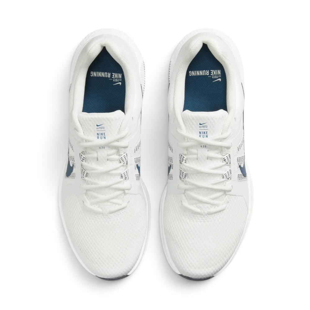 Focuses on the locked-in central lacing layout, displaying the clean symmetry of the white mesh forefoot, midfoot lacing loops, white tongue tags with "NIKE RUN V 2.0" text, and dark blue insoles printed with "NIKE RUNNING" branding.