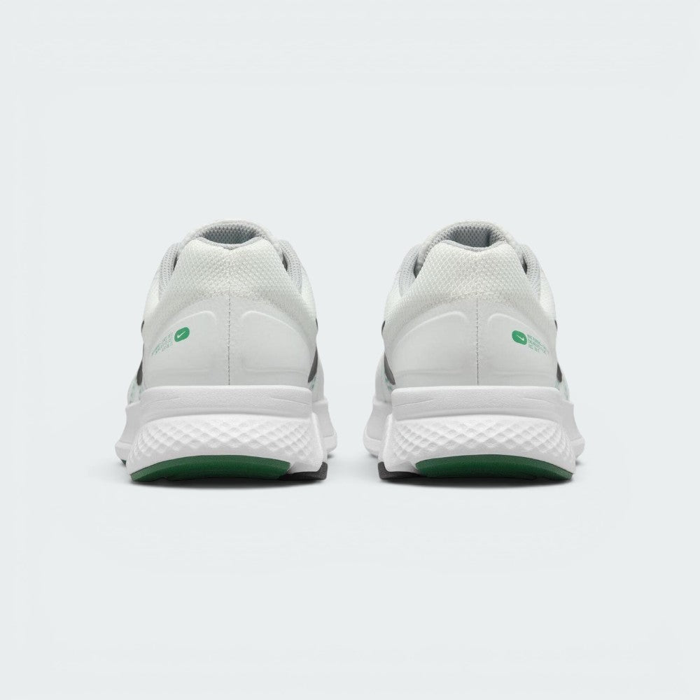 Focuses on the rear profile of both heels, displaying the clean white mesh collars, structured heel cups accented with green oval Swoosh badges, and the wide footprint of the white foam midsoles above the green tread base.