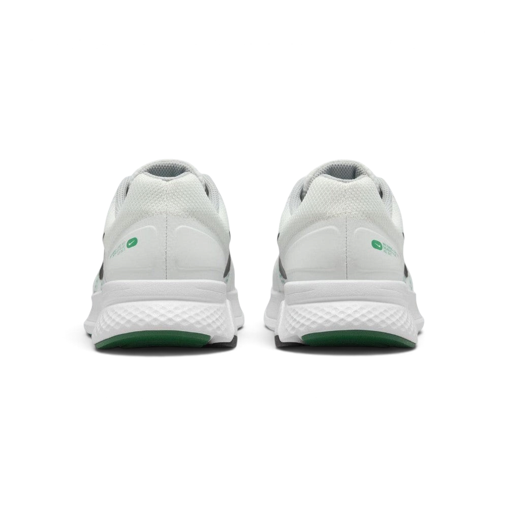 Focuses on the rear profile of both heels, displaying the clean white mesh collars, structured heel cups accented with green oval Swoosh badges, and the wide footprint of the white foam midsoles above the green tread base.
