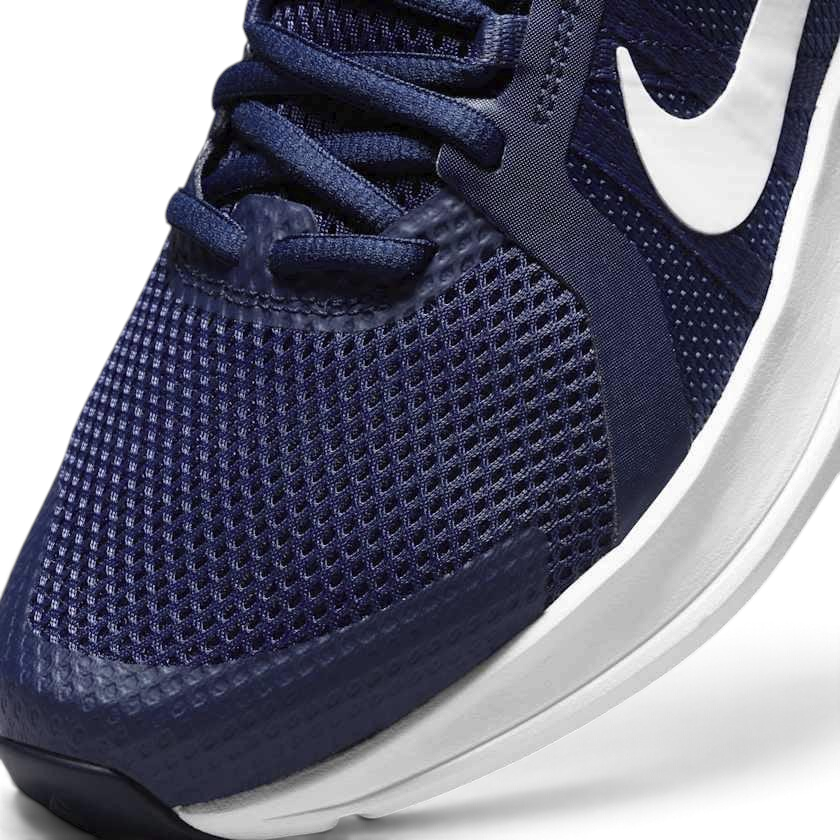 Close-up zoom on the front of the Nike Run Swift 2 Men's navy running shoes, showing the mesh upper texture, lacing system, and Flywire cables.