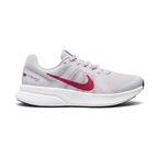 Nike Run Swift 2 Women's running shoes in pink with white accents, side profile showing breathable mesh upper, foam midsole, and Nike Swoosh.