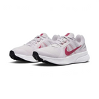 Angled view of two Nike Run Swift 2 Women's pink running shoes, side by side, showcasing their versatile design and cushioned profile.