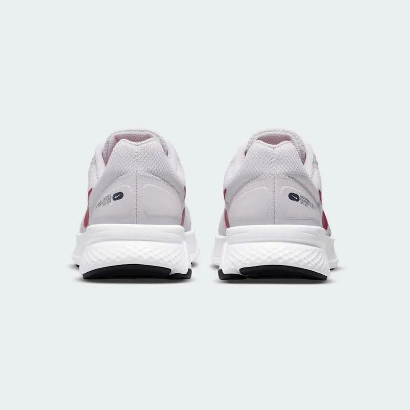Rear view of the Nike Run Swift 2 Women's pink running shoes, focusing on the structured heel and subtle branding.
