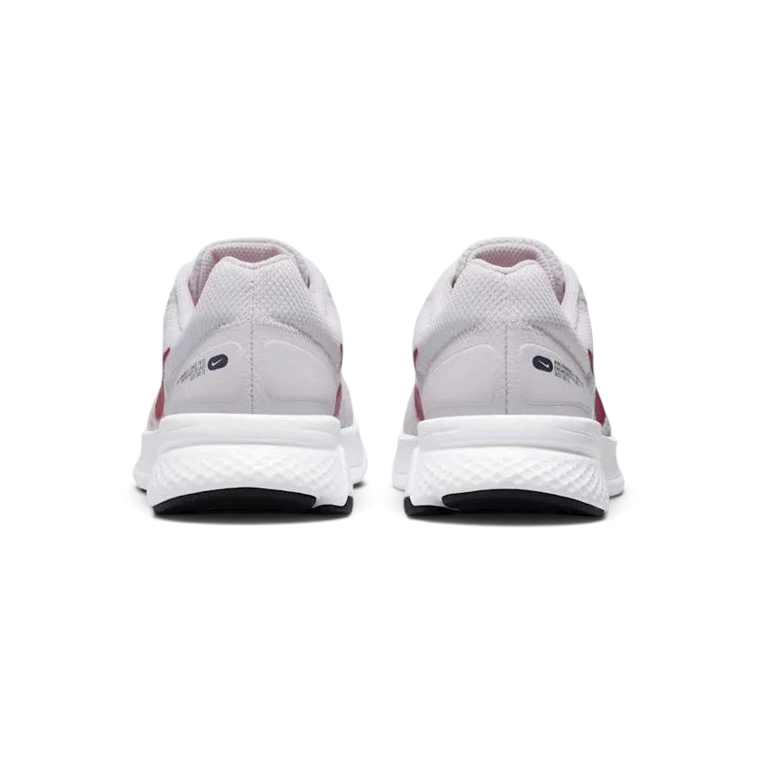 Rear view of the Nike Run Swift 2 Women's pink running shoes, focusing on the structured heel and subtle branding.