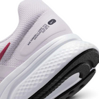 Detailed zoom on the outsole and midsole of the Nike Run Swift 2 Women's pink running shoes, highlighting the soft foam cushioning and durable rubber outsole.