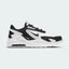 Highlights the high-velocity sweep of the small black Nike Swoosh, showing the professional texture of the white mesh upper, the contrasting black overlays, and the visible heel Air unit embedded in the white foam midsole wall.