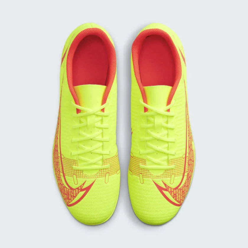 Top-down view of a pair of Nike Mercurial Vapor 14 Club FG/MG men's football boots in vibrant volt/black/crimson, showcasing the upper texture.