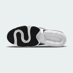 View of the outsole of the Nike Air Max Infinity 2 Men's black trainers, showing durable rubber details and a functional tread pattern.