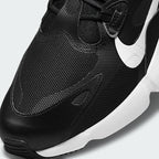 Close-up zoom on the front of the Nike Air Max Infinity 2 Men's trainers, showing the mesh toe box, unique lacing system, and layered upper materials.