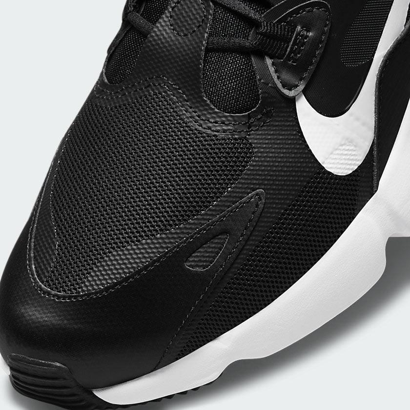 Close-up zoom on the front of the Nike Air Max Infinity 2 Men's trainers, showing the mesh toe box, unique lacing system, and layered upper materials.