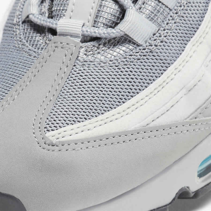 Close-up zoom on the front of the Nike Air Max 95 Men's running shoes, showing the intricate lacing system, mesh tongue, and layered overlays.