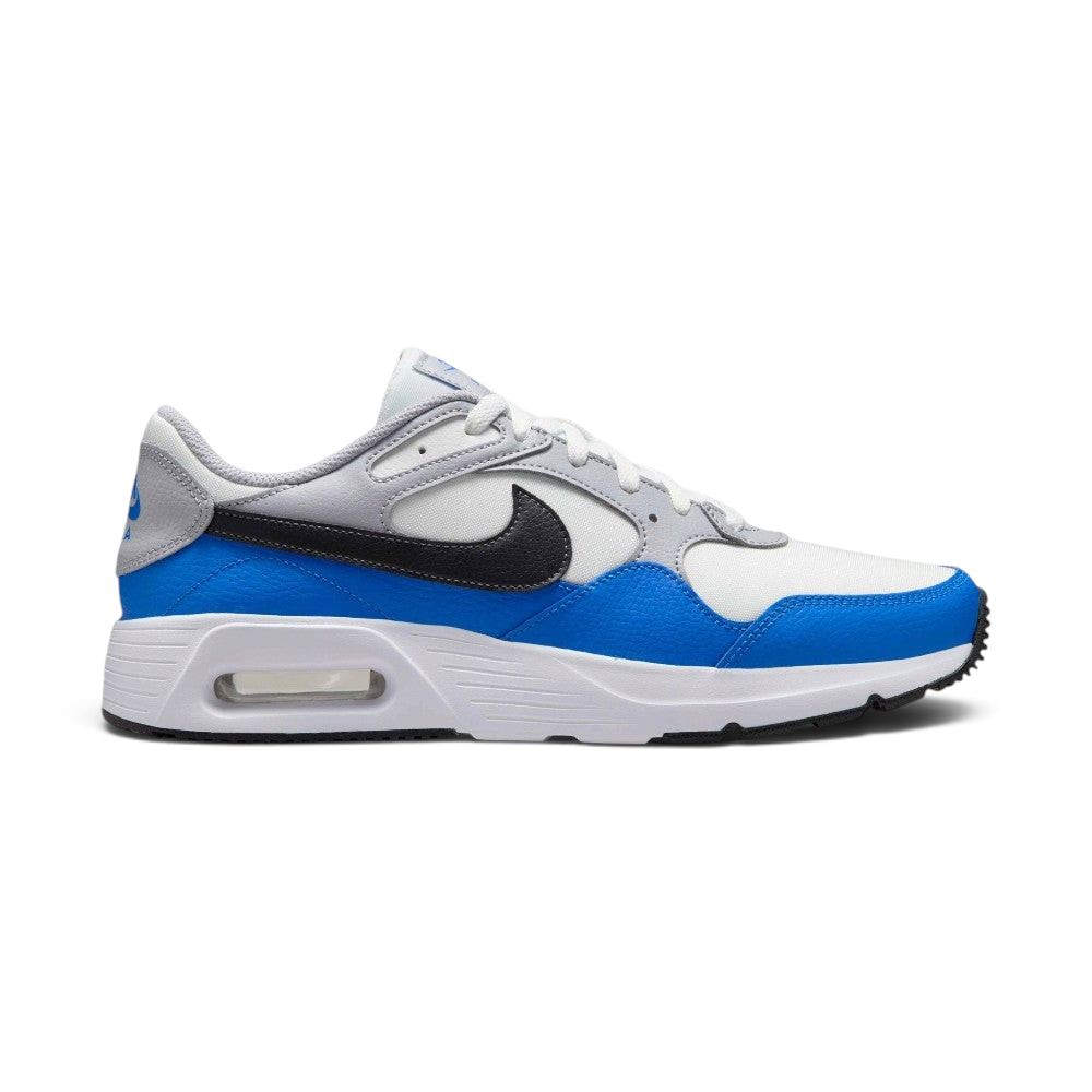 Highlights the lateral profile of the shoe, featuring a sleek Anthracite black Nike Swoosh sweeping across the Summit White mesh quarter panel, vibrant Light Photo Blue leather mudguards, Wolf Grey upper eyelet overlays, and the visible Air window embedded in the white foam midsole.