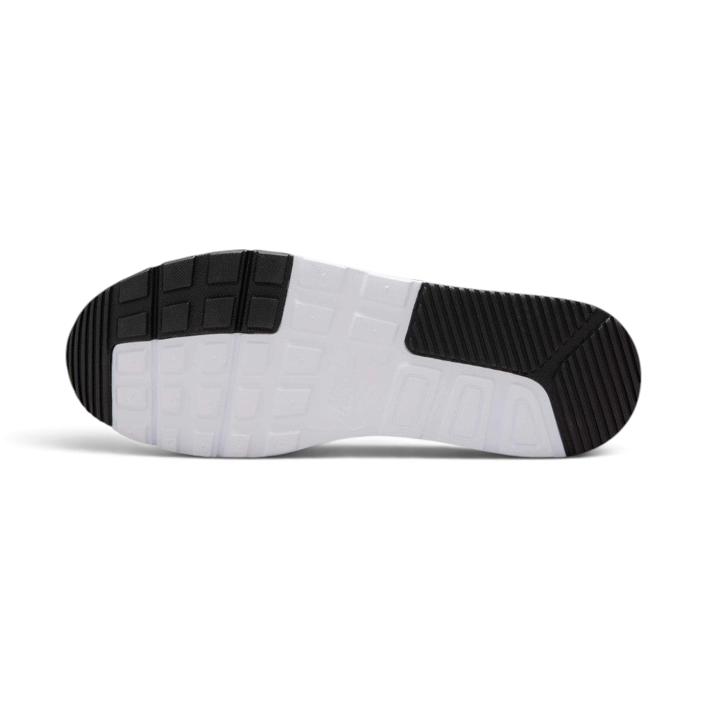 Displays the full-length durable rubber outsole, showcasing the grooved black traction pods on the toe and heel zones interlocked with a central white waffle-inspired grid pattern.