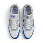 Focuses on the locked-in central lacing layout, displaying the clean symmetry of the white mesh tongue, matching white laces, grey eyestay panels, and blue "NIKE AIR" branding printed on the comfort insoles.