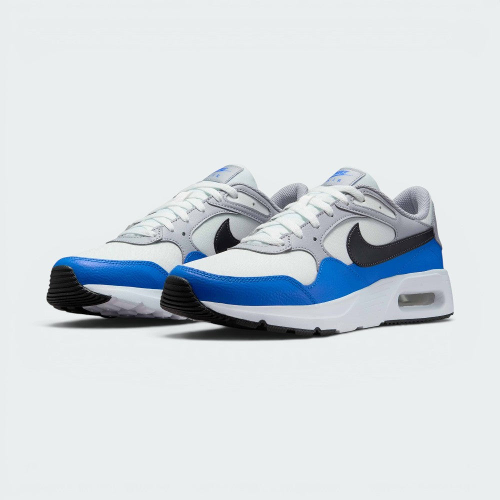 Emphasising the low-cut, athletic stance of the trainers and the harmonious contrast between the Summit White bases, Wolf Grey trim, and vivid Light Photo Blue mudguards.