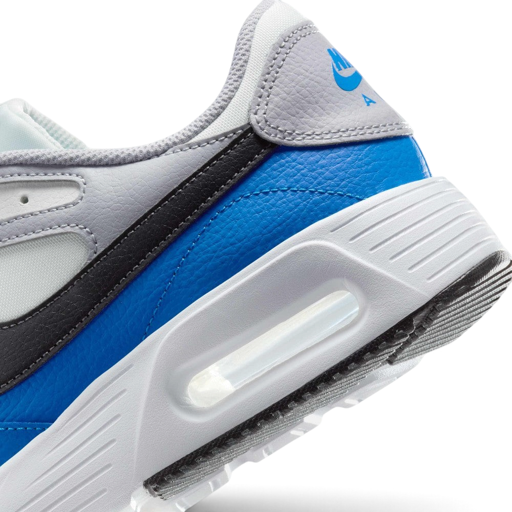Highlights the "unreal" clean finish where the smooth white foam midsole carrier meets the textured black rubber outsole tread, framing the transparent Max Air cushioning capsule.