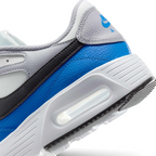 Highlights the "unreal" clean finish where the smooth white foam midsole carrier meets the textured black rubber outsole tread, framing the transparent Max Air cushioning capsule.