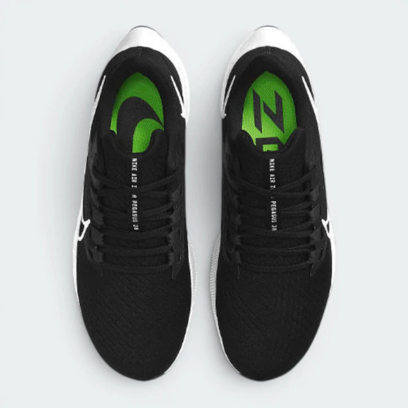 Focuses on the locked-in midfoot webbing layout, displaying the exact symmetry of the extra-padded black tongue and the roomier, wide-cut mesh toe box area.