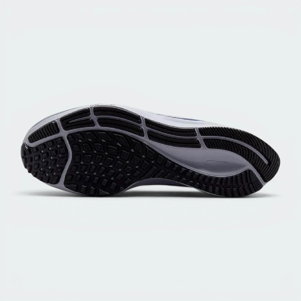 Displays the classic segmented waffle-grid traction pattern of the heavy-duty black rubber sole, engineered for unreal everyday road grip and smooth heel-to-toe transitions.
