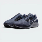 Emphasising the athletic, aerodynamic running stance and the professional distribution of the dark blue panels.