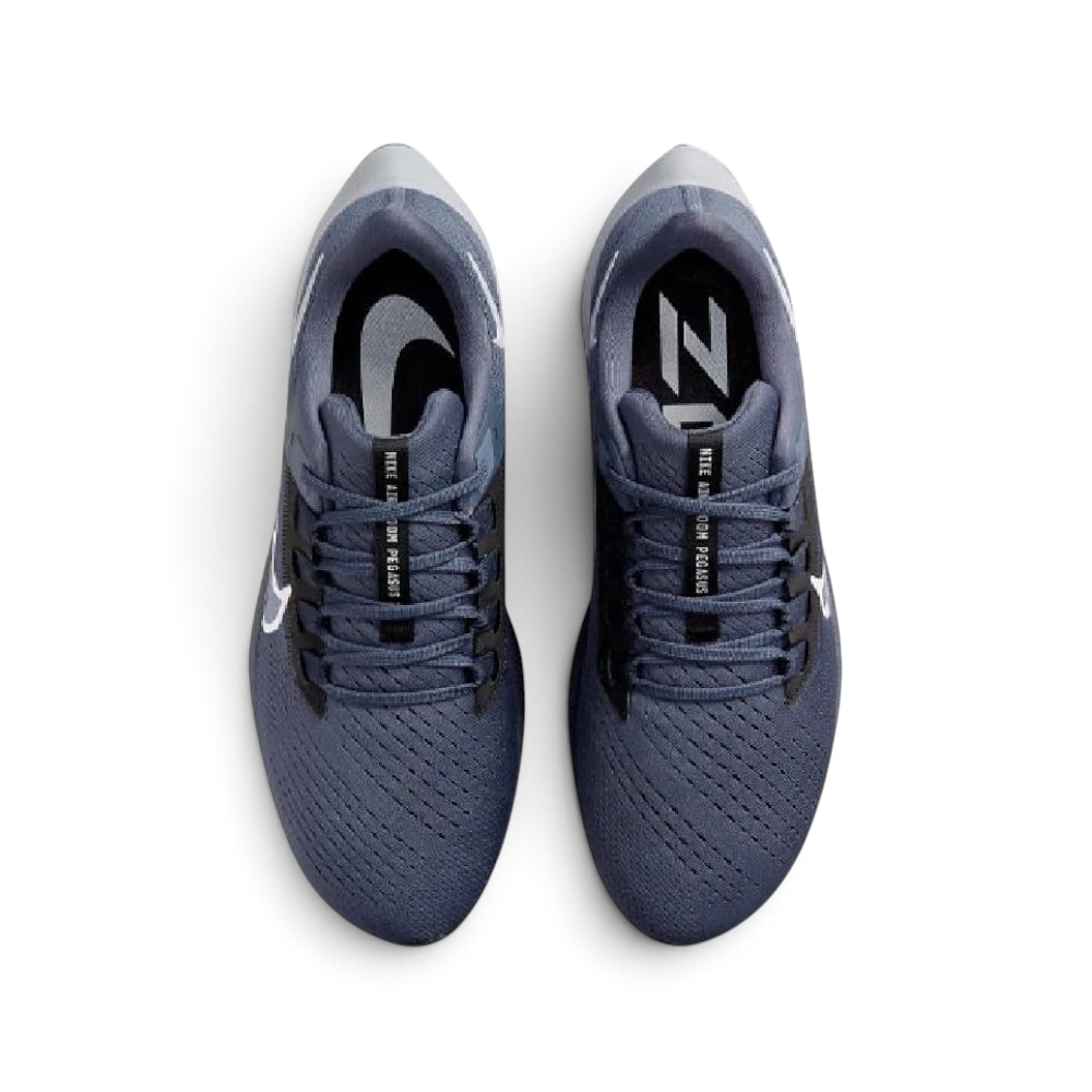 Focuses on the locked-in midfoot webbing layout, displaying the exact symmetry of the extra-padded black tongue and the roomier, wide-cut mesh toe box area.