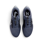 Focuses on the locked-in midfoot webbing layout, displaying the exact symmetry of the extra-padded black tongue and the roomier, wide-cut mesh toe box area.