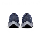 Focuses on the contoured shape of the tapered rear heel collar, highlighting the clean, structural sweep of the rear foam wedge built to relieve Achilles tendon pressure.