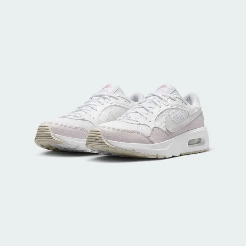 Nike Air Max SC Juniors White Trainers CZ5358-115 angled view showing sculpted midsole and layered material design