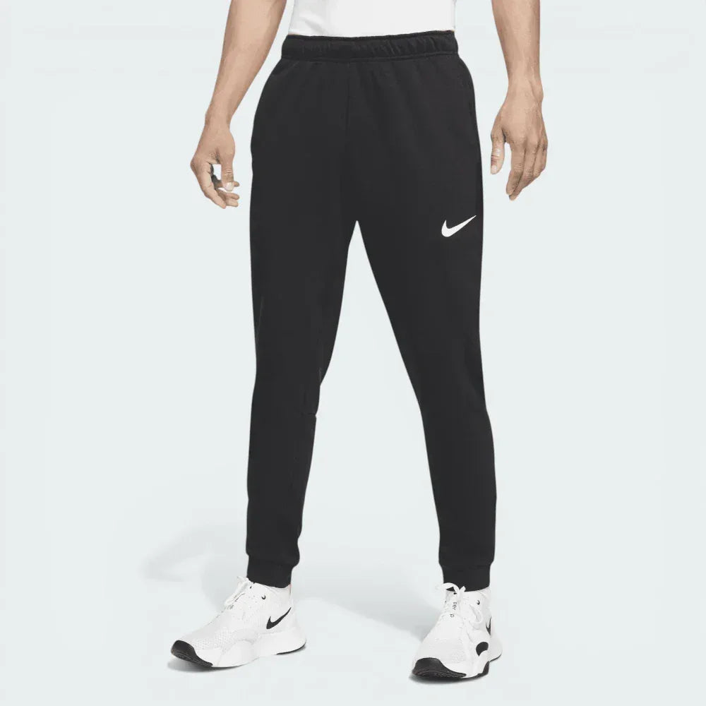 Overhead view of the fitness trousers laid flat, highlighting the elastic waistband and the quality of the French terry fleece.