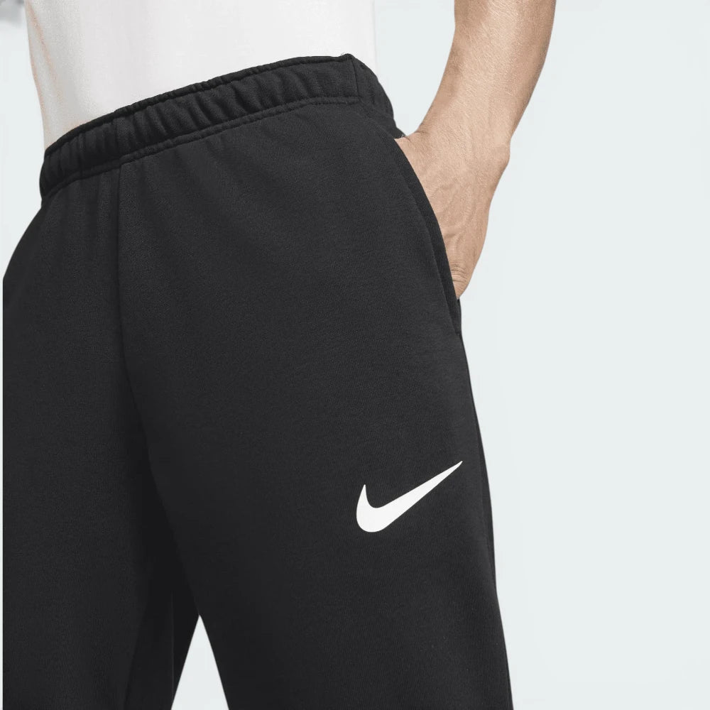 Close-up of the waistband area, focusing on the internal drawcord and the high-quality embroidered white Nike logo.