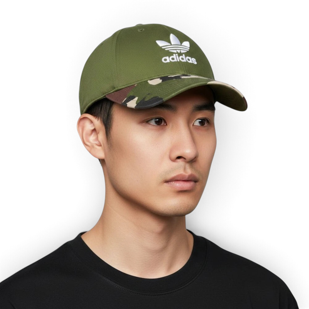 Highlights the high-velocity visual contrast of the solid Wild Pine crown paneling sitting perfectly above the professional, earth-toned grid depth of the camouflage printed brim. Main image