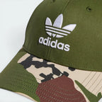 Emphasising the clean visual placement of the embroidered Trefoil logo standing proud against the pine fabric backdrop.