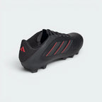 Focuses on the sleek heel construction and the professional finish of the synthetic leather.